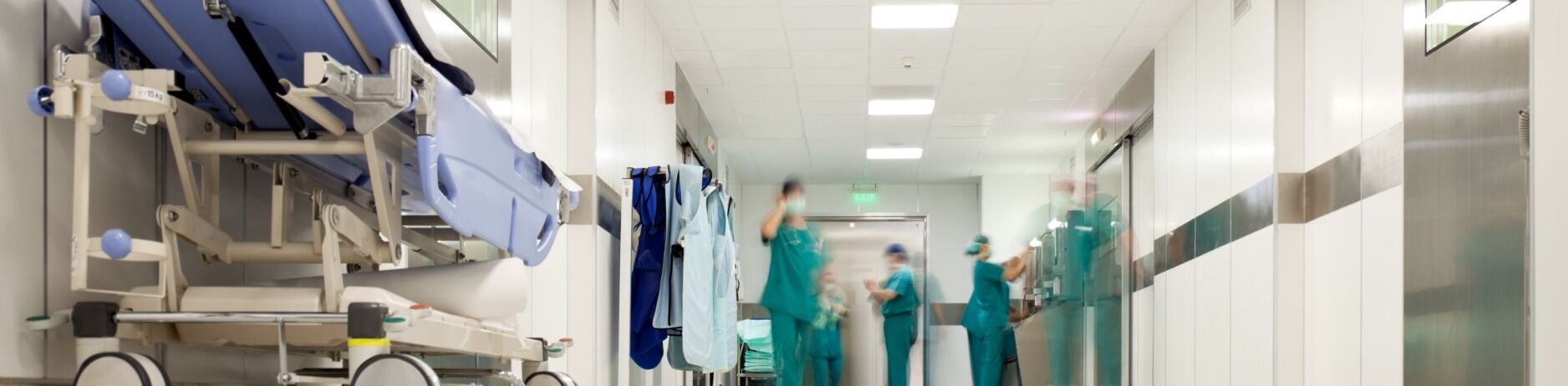 Doctors in hospital hallway preparing to treat various types of personal injury cases